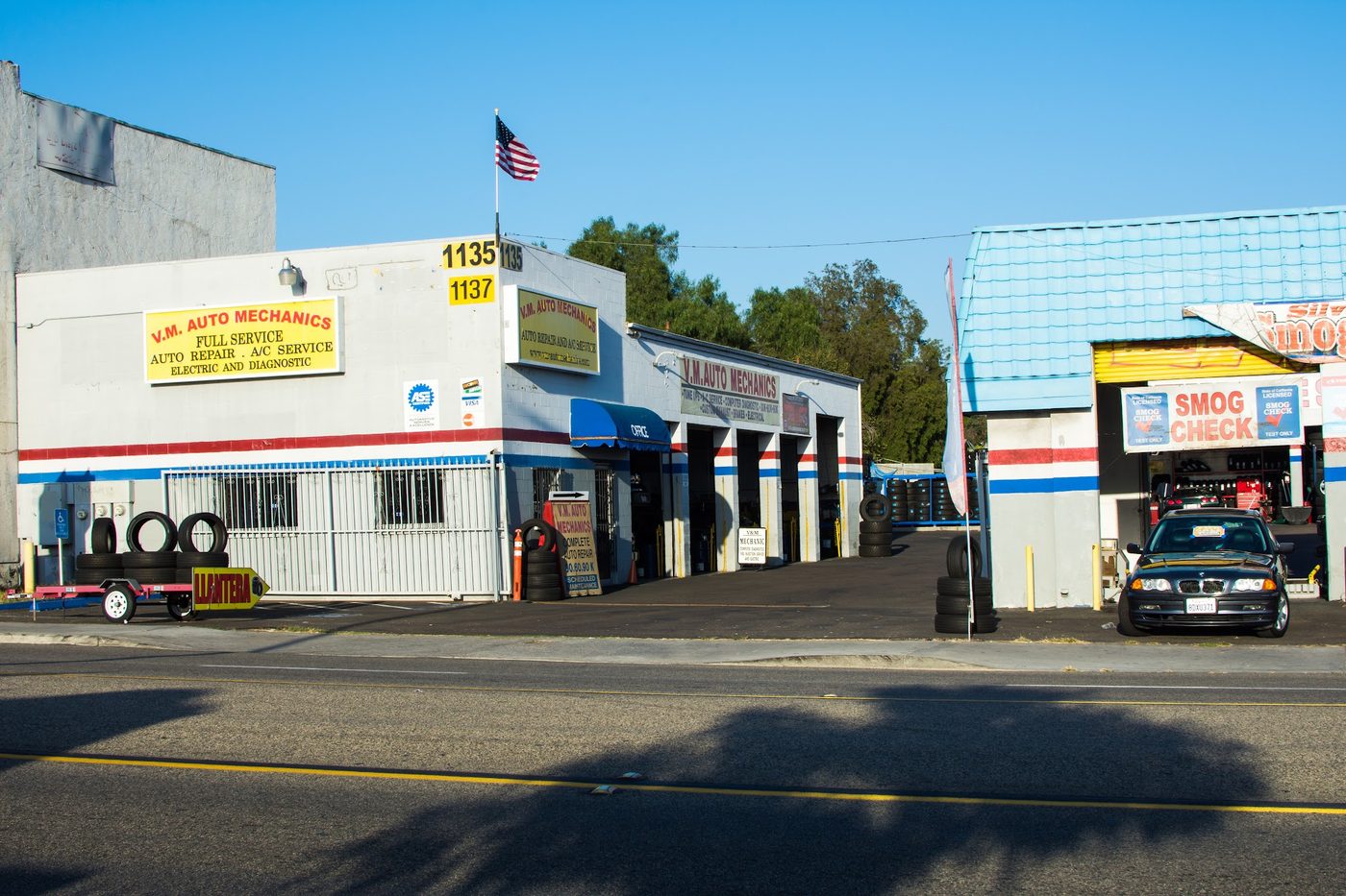 Street view of the V.M. Auto Mechanics building on 3rd Ave with its full-service, A/C and electrical signs